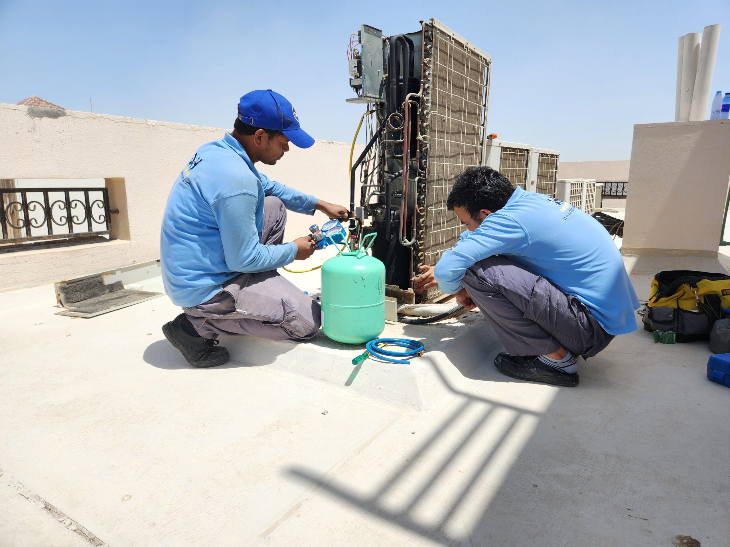 Drill and hammer's team member performing AC Maintenance in Abu Dhabi